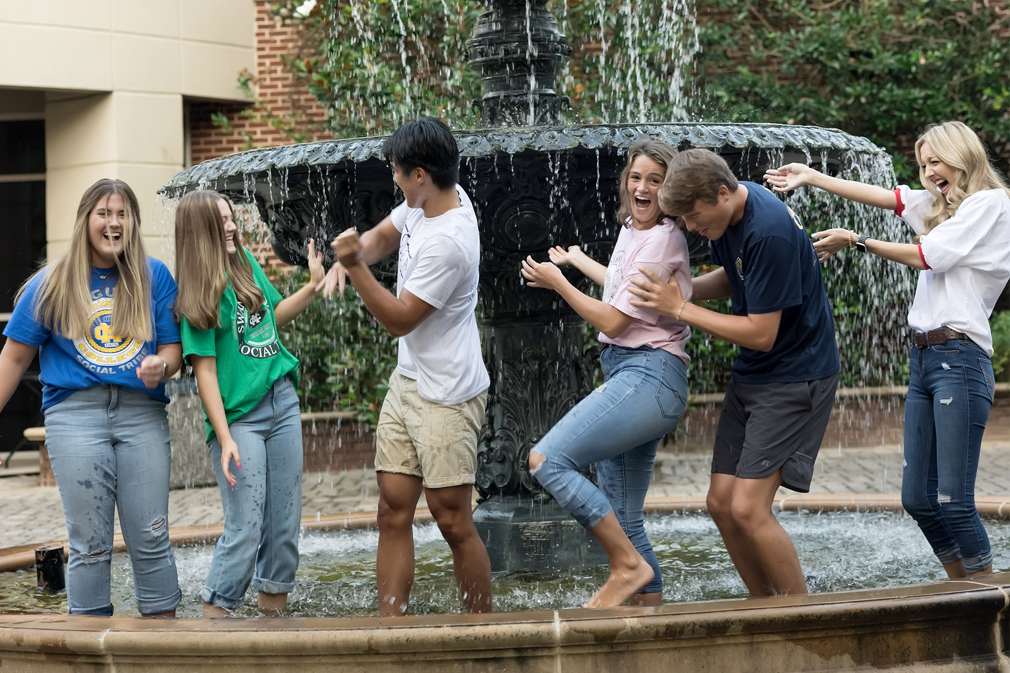 Students dancing in the fountain